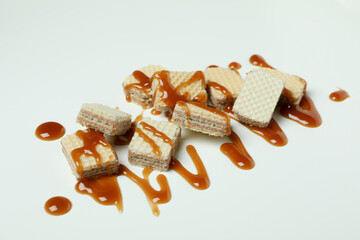 Wafers with caramel on white background, close up
