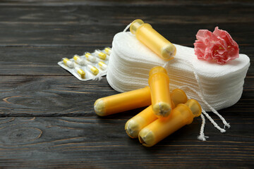 Concept of menstruation on wooden background, space for text