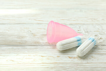 Concept of menstruation on wooden background, space for text