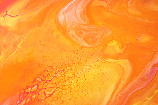 Abstract fluid art background dark orange and yellow colors. Liquid marble. Acrylic painting with brick gradient.