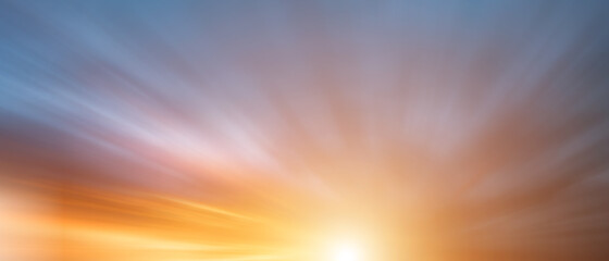Orange sky during sunset with long exposure, blur effect