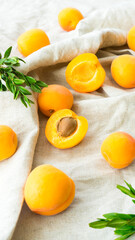 Bright and ripe apricots on a kitchen towel