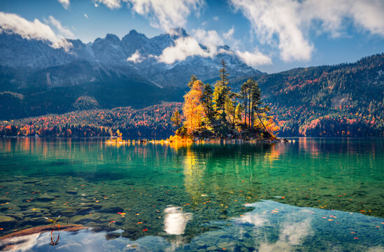 Wonderful autumn scenery. Amazing morning view of Eibsee lake with Zugspitze peak on background. Stunning autumn scene of Bavarian Alps, Germany. © Andrew Mayovskyy