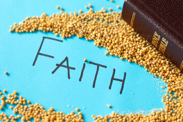 Mustard seed faith in God Jesus Christ. Faithful Christian concept. Holy Bible with handwritten...