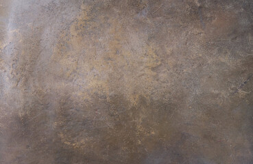 The texture of the worn bronze background is covered with a patina	