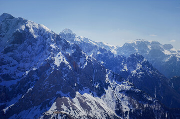 Fototapeta na wymiar severe view of spring still snowy slovenian alps Mala Mojstrovka