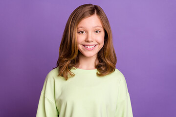 Obraz premium Photo of young cheerful school girl happy positive smile toothy isolated over purple color background