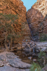 People at the Meiringspoort waterfall in the Swartberg mountain