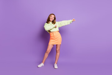 Full size photo of young attractive girl happy positive smile have fun dance isolated over violet color background