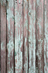 Naklejka premium Оld fence with peeling paint. Grange texture background.