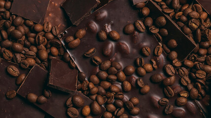 Coffee beans and chocolate close-up. Natural brown background.