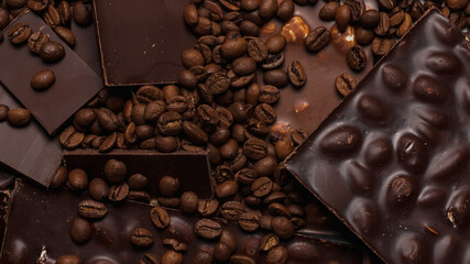 coffee beans close-up and chocolate. Dark chocolate bar. Natural background of cinnamon color.