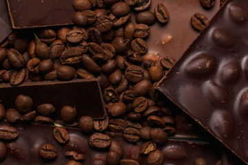 Coffee beans and chocolate close-up. Natural brown background.