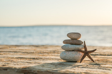 Blue Sea on Background Selective focus, zen stones on sea beach, meditation, spa, harmony, calm, balance concept
