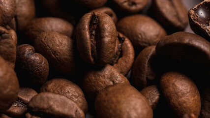 Coffee beans close-up. The natural background is brown. Lots of coffee.