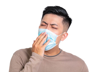  sleepy young man wearing medical mask and yawning