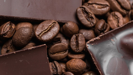 Coffee beans and chocolate close-up. Natural brown background.