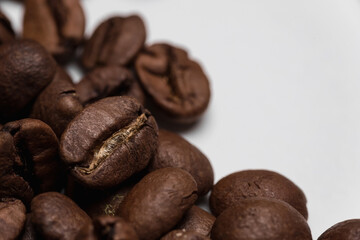 Coffee beans close-up. The natural background is brown. Lots of coffee.