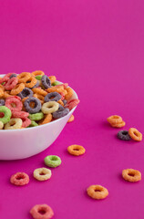 multicolored bright dry breakfast on pink background