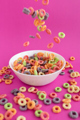 multicolored bright dry breakfast on pink background