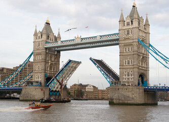 Fototapeta na wymiar Tower Bridge, London, open to allow boats to pass through.