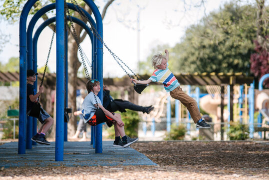 USA, California, San Francisco, Children on swings at playground