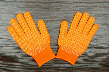 Work gloves on wooden background	