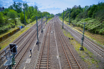Obraz premium Train tracks without train and wagons. Top shot. Day. How is long-distance traffic developing on the world's train tracks?