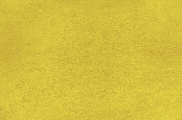 Fototapeta premium Golden yellow stucco texture background, acrylic plaster facade closeup