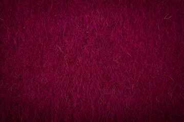 Coarse deep purple wool background texture