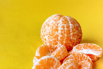 Bergamot mandarin on yellow background.