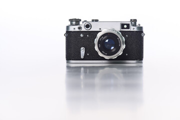 A Retro camera of classic design against a White Background
