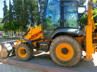 Fototapeta na wymiar Mini bulldozer or excavation or loader on road.