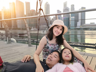 Asian family relaxing in Singapore.