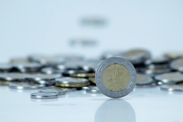 Mexican five pesos coin.