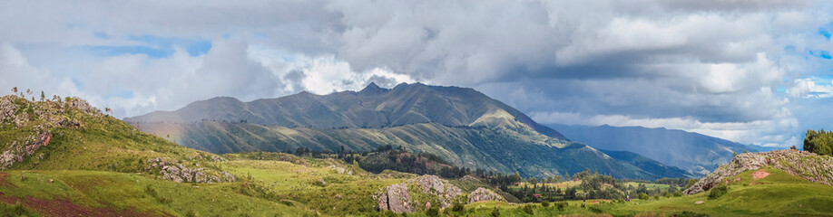 Panoramic view of green fields and beautiful landscape hills of Cusco near Qenqo Archaeological...
