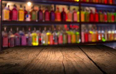 Classic bar counter with bottles in blurred background