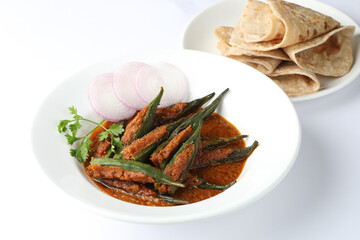 Bharwa Masala Bhindi or Stuffed Okra is an indian main course vegetable recipe made using ladies' fingers  and spices Masala Stuffed ladyfinger, Indian Bharwa bhindi  masala fried Okra  with chappathi