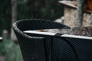 Chair and table under rain