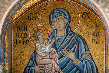 Gold mosaic of Mary and Jesus above the entrance to of the geek-orthodox Kapnikarea-Church (Church of the Assumption of the Virgin Mary) in the Center of Athens, Greece