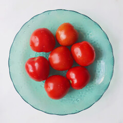 Fresh red tomatoes on the plate
