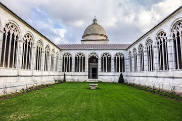 Campo Santo (or Camposanto Monumentale - "monumental cemetery" or Camposanto Vecchio - "old cemetery", XII century) at edge of Pisa Cathedral Square. Pisa, Tuscany, Italy.