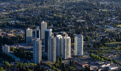 Fototapeta na wymiar Aerial View from an Airplane of Residential Homes and Buildings near Surrey Central Mall. Greater Vancouver, British Columbia, Canada.