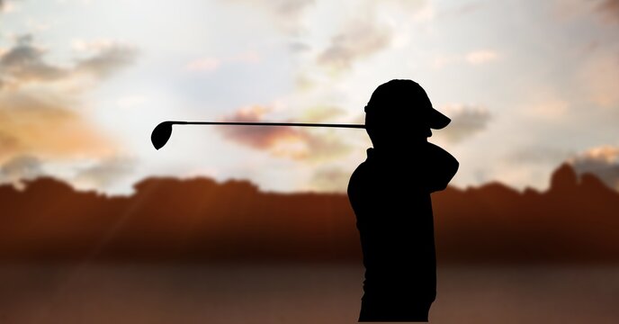 Composition of silhouette of male golf player over clouds on sky with copy space