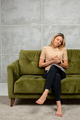 Blonde young woman writing and crumple paper 