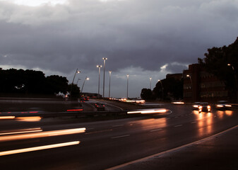 Cars Light Up The Highway During Sunrise.