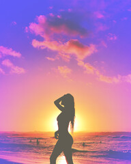 Silhouette of beautiful woman with long hair at the beach for sunset