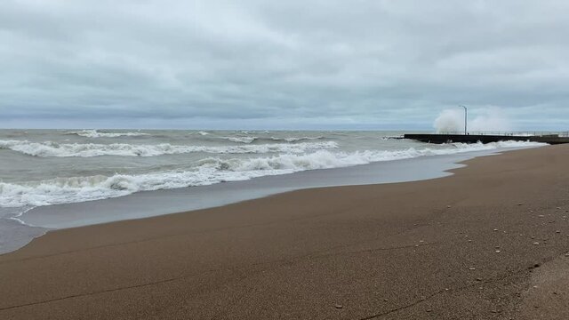 Tower Beach (Winnetka, IL) Along Lake Michigan On A Stormy Day As Waves Crash Along The Shore In The Background. The Beach Is Closed Due To Rough Water And Gale Wind Warnings.