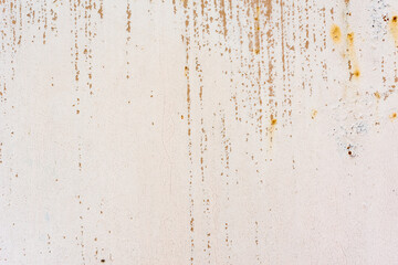 Background of rusty metal wall covered with paint peeling off