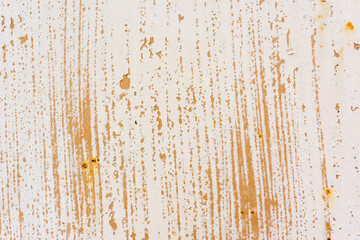 Background of rusty metal wall covered with paint peeling off